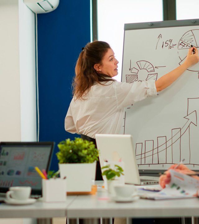 focused-team-leader-presenting-marketing-plan-interested-multiracial-coworkers-serious-speaker-boss-executive-business-trainer-explaining-development-strategy-motivated-mixed-race-employees (2)